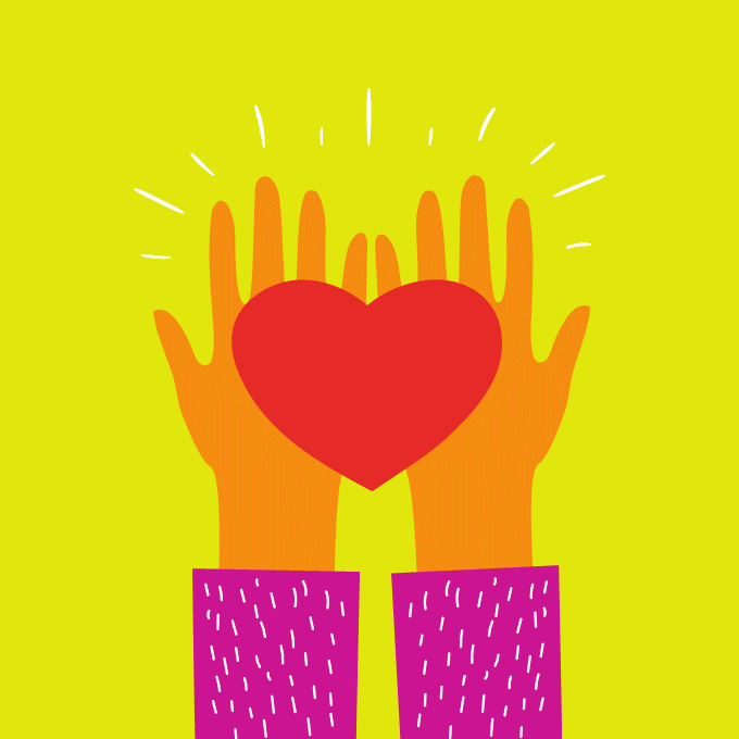 A couple holding hamds walking along the beach