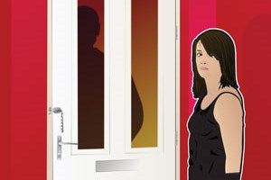 A young person standing next to the front door where a person can be seen behind the glass