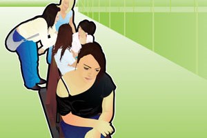 A girl sat on the ned of a bench and a group of others at opposite end chatting