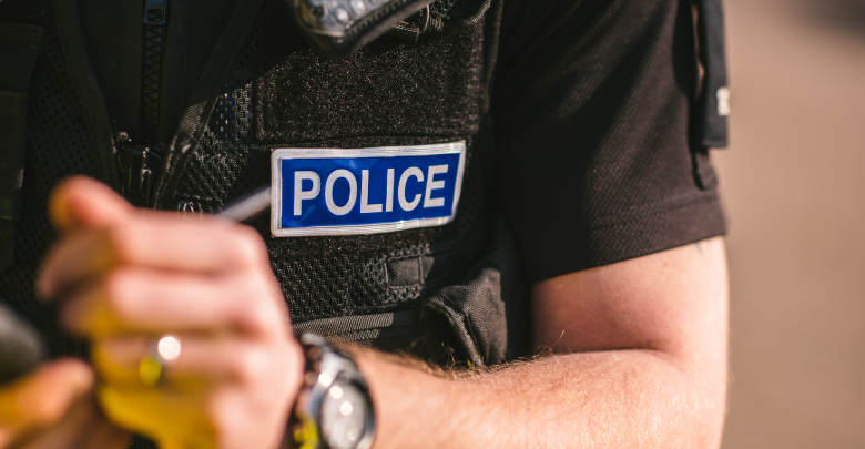 A police officer taking notes